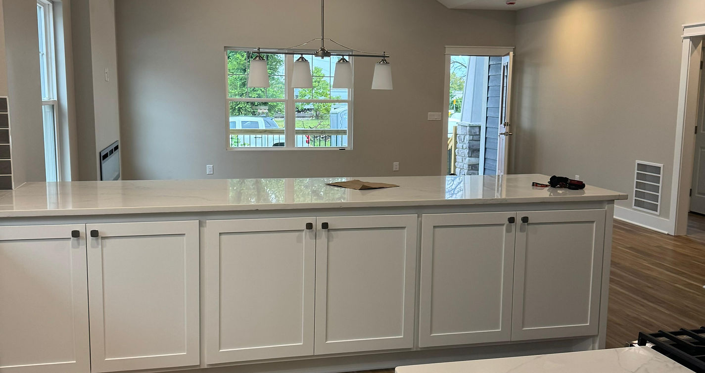 White custom kitchen with a large island